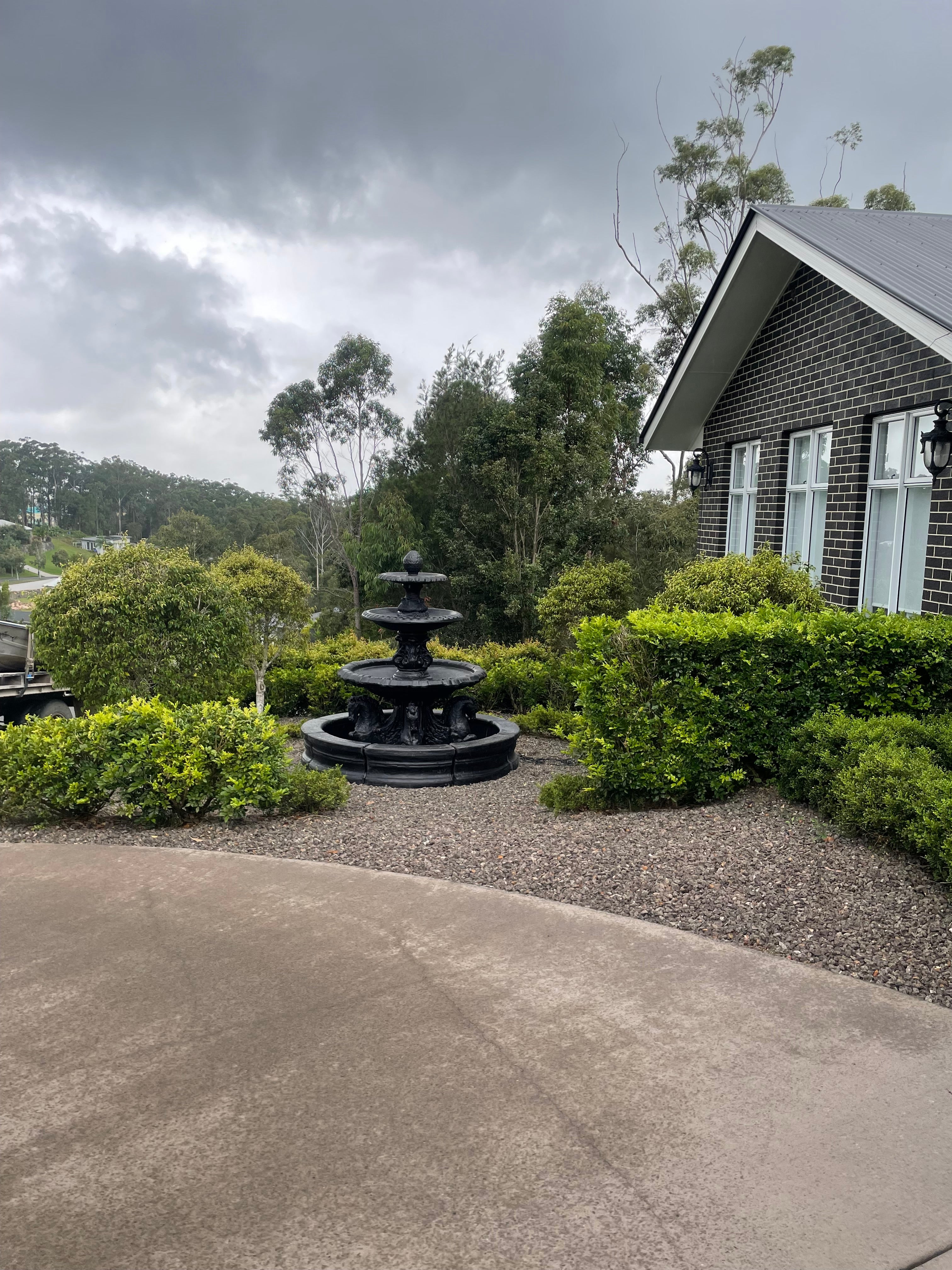 3 tier quarter horse fountain with round acorn and traditional pond