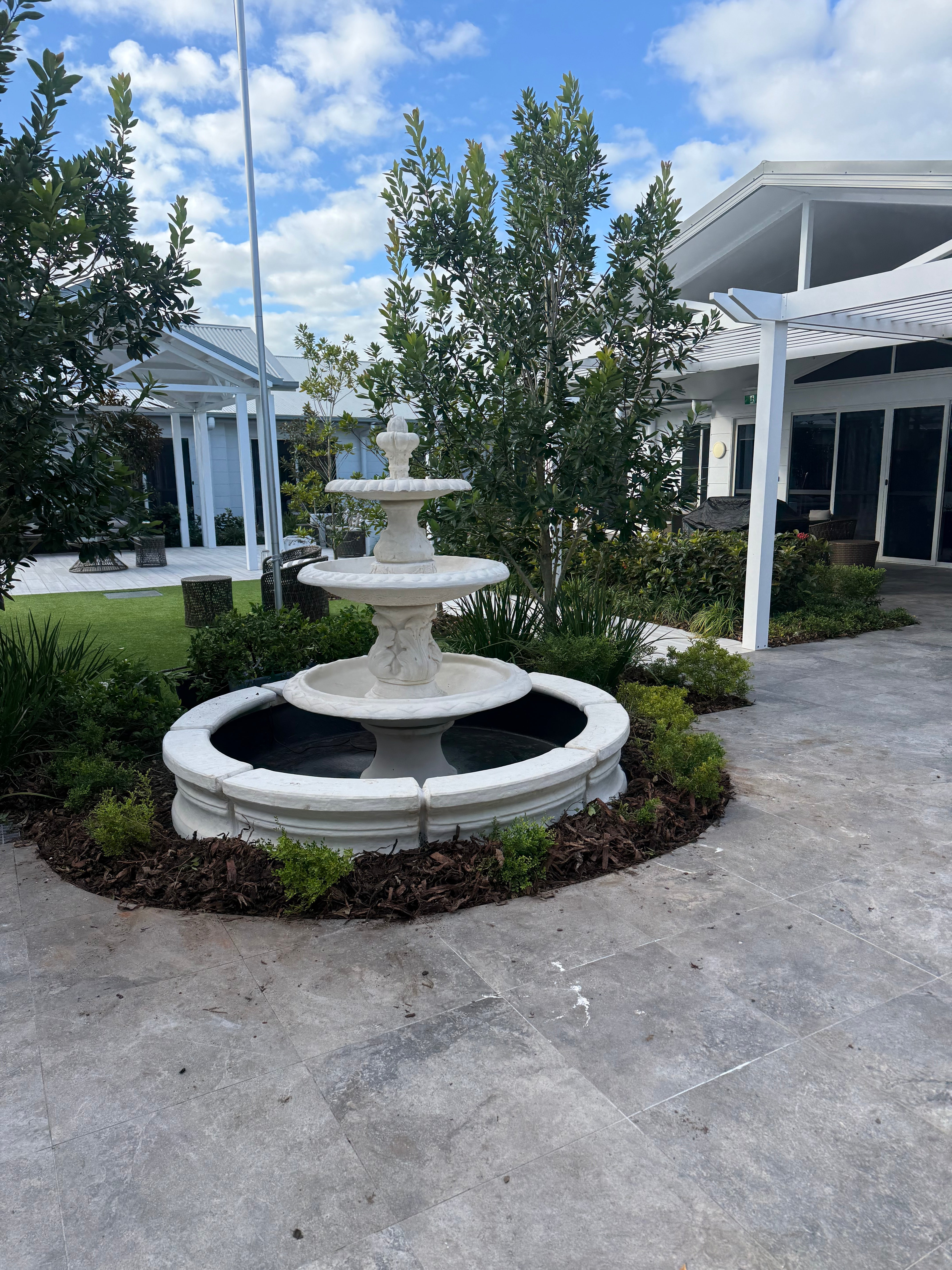3 tier diamond fountain with traditional acorn and traditional pond surround